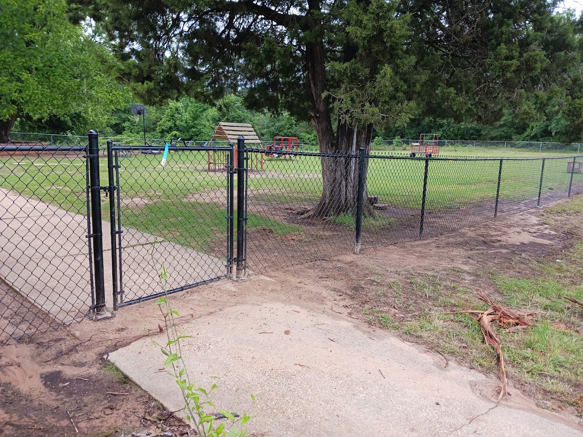 Black chain link fence with gate installed by Parker Fence Co.