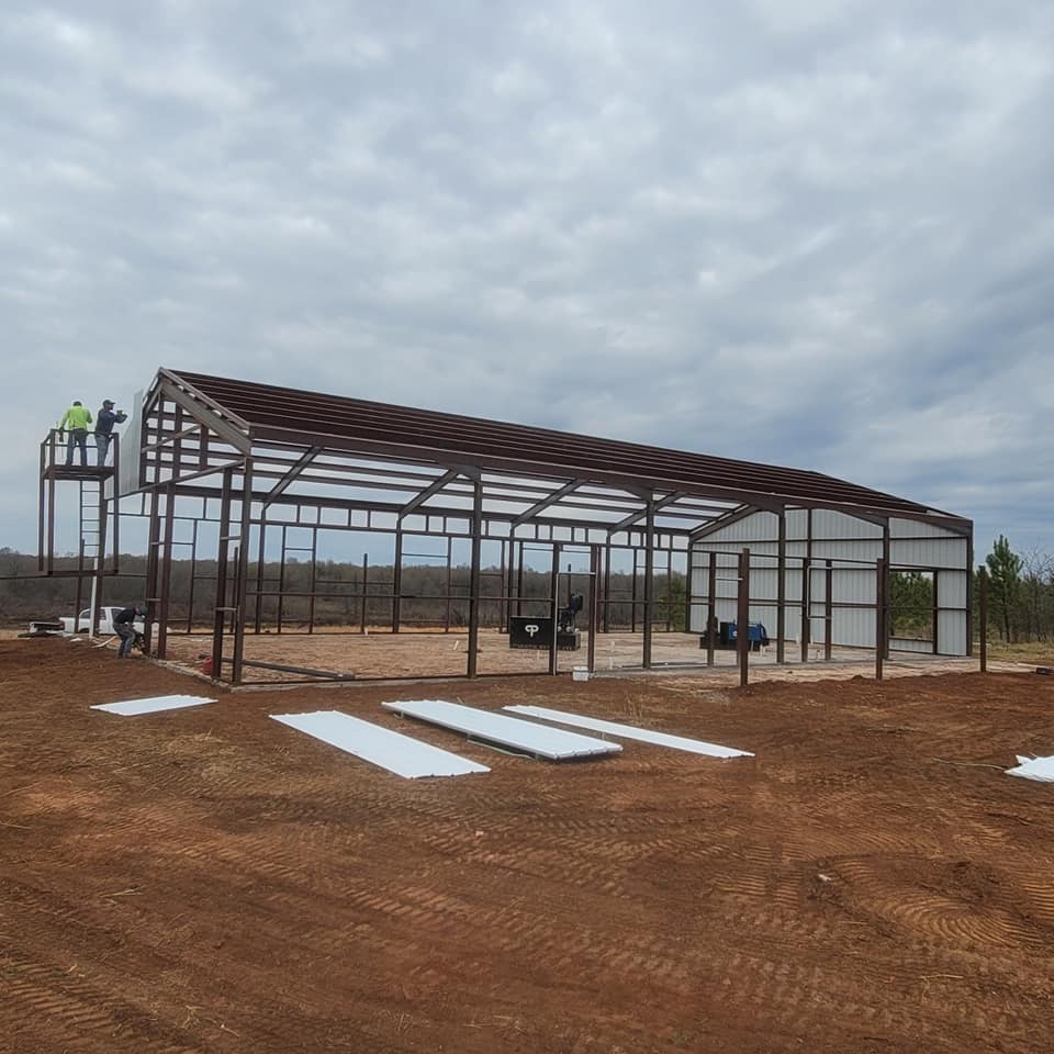 Metal building frame going up on a Parker Fence Co. project