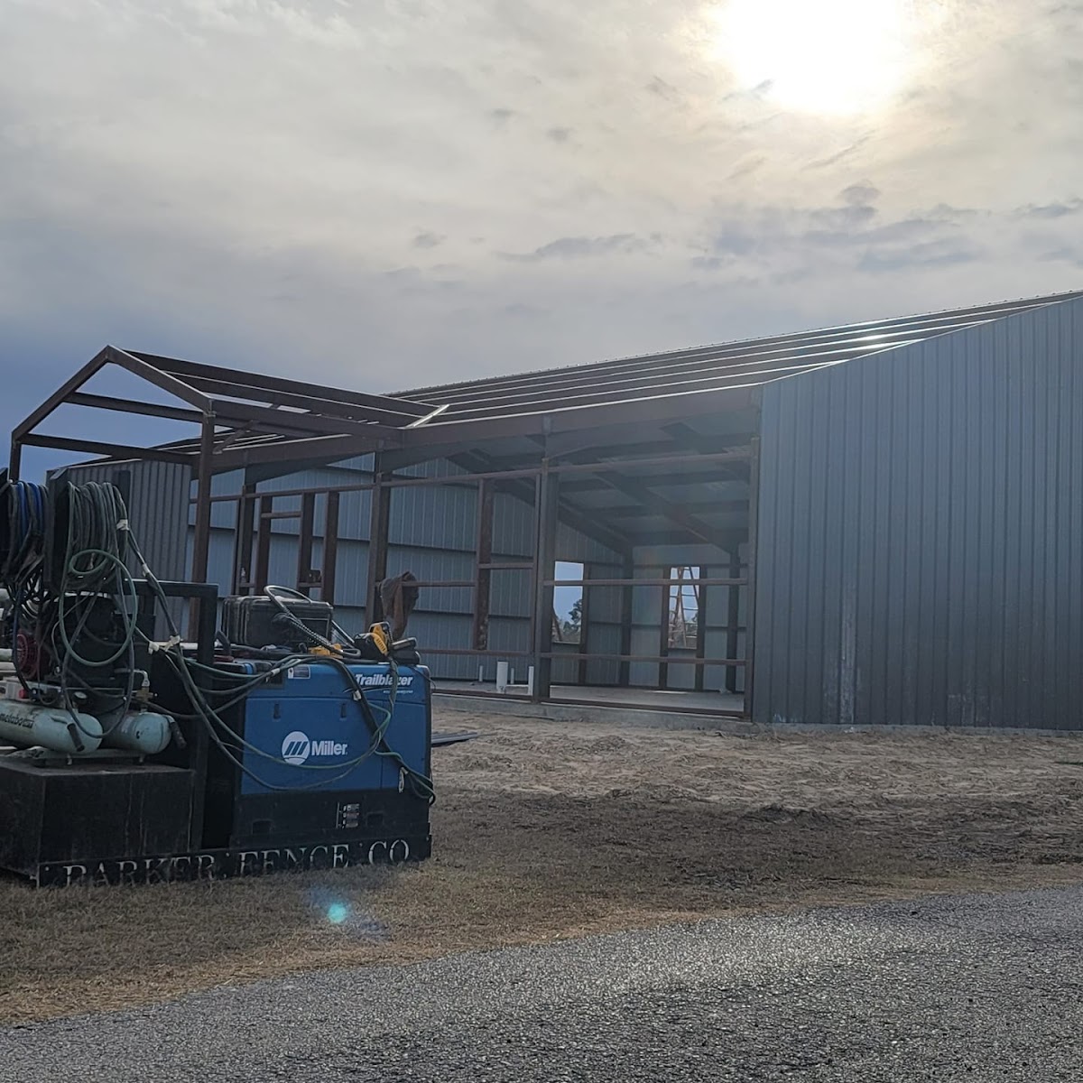 Metal building construction project by Parker Fence Co.